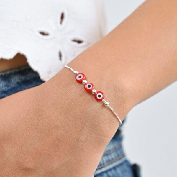 Pulsera tres ojos turcos rojo